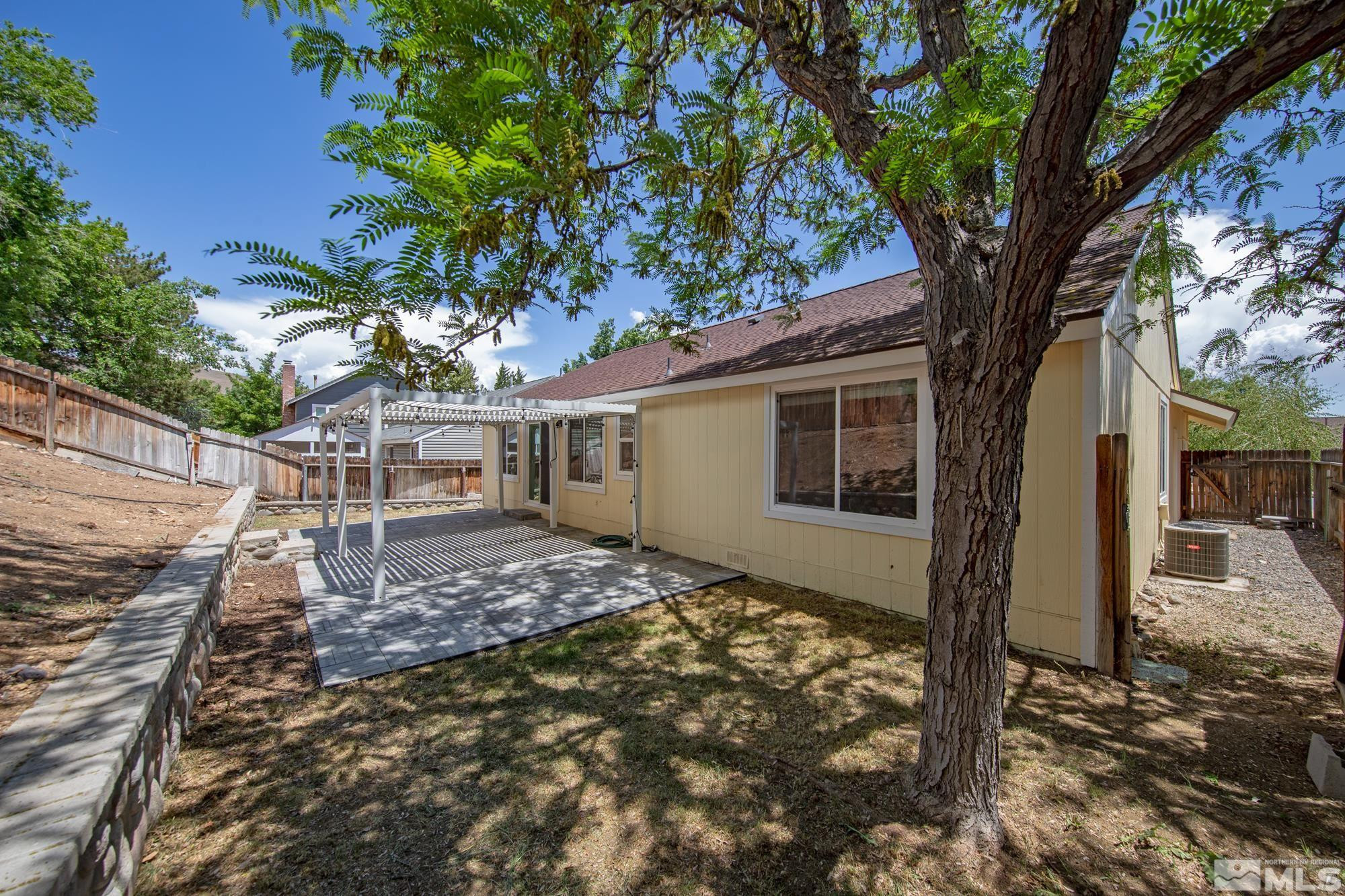 3805 Bexley Square Reno, NV 89503 - Photo 29 of 35 a view of a house with a tree in the yard