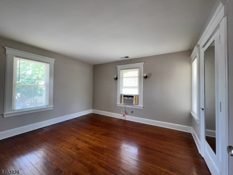 40 Codington Place Somerville, NJ 08876 - Photo 7 of 10 an empty room with wooden floor and windows