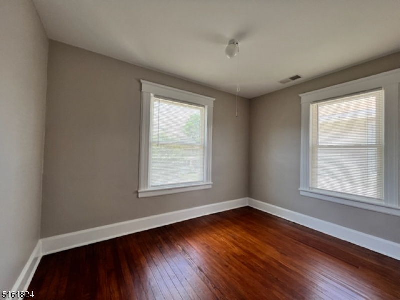 40 Codington Place Somerville, NJ 08876 - Photo 8 of 10 an empty room with wooden floor and windows