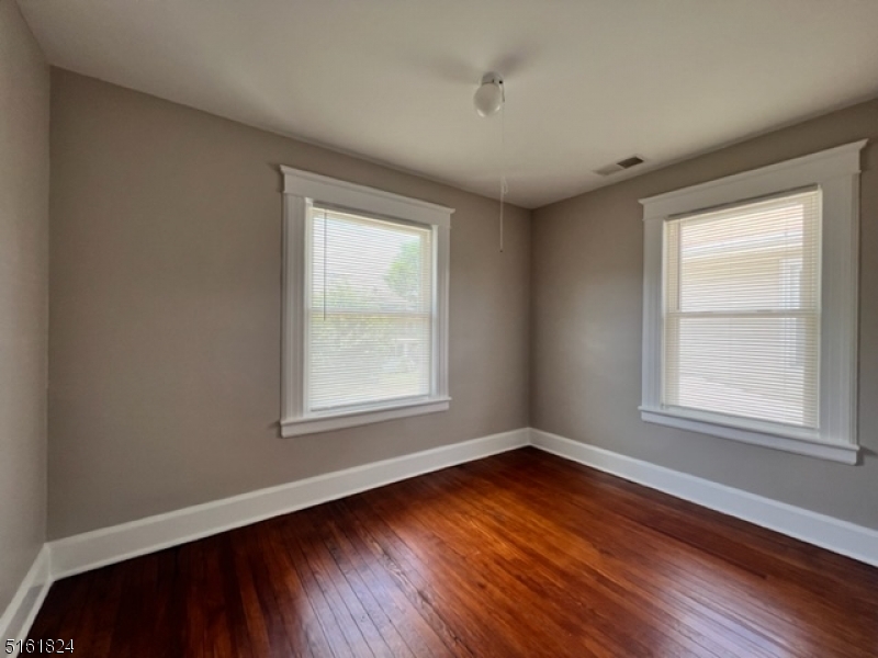 40 Codington Place Somerville, NJ 08876 - Photo 9 of 10 an empty room with wooden floor and windows