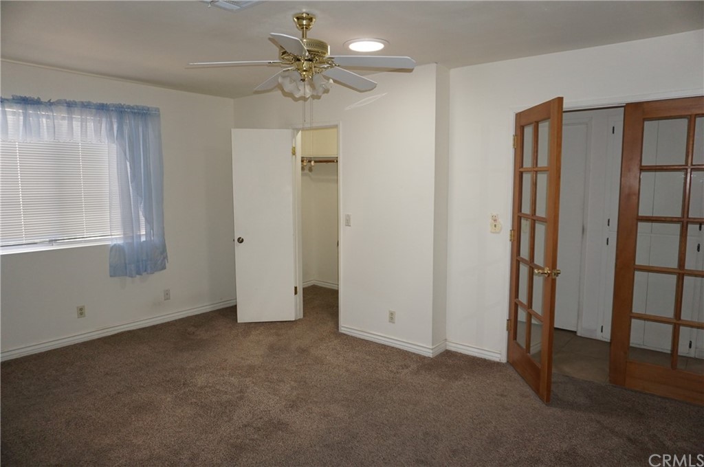 27841 Crestview Road Barstow, CA 92311 - Photo 15 of 28 an empty room with windows and closet