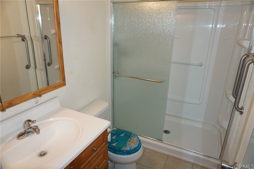 27841 Crestview Road Barstow, CA 92311 - Photo 16 of 28 a bathroom with a sink and a mirror