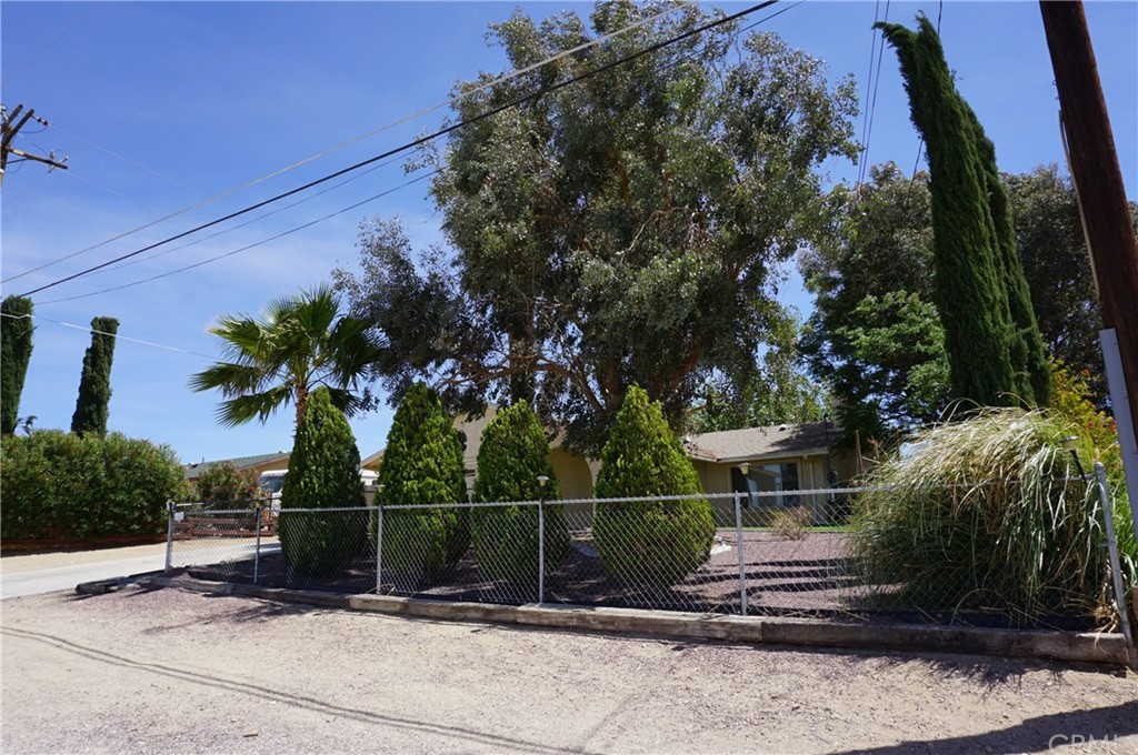 27841 Crestview Road Barstow, CA 92311 - Photo 6 of 28 a backyard of a house with lots of green space