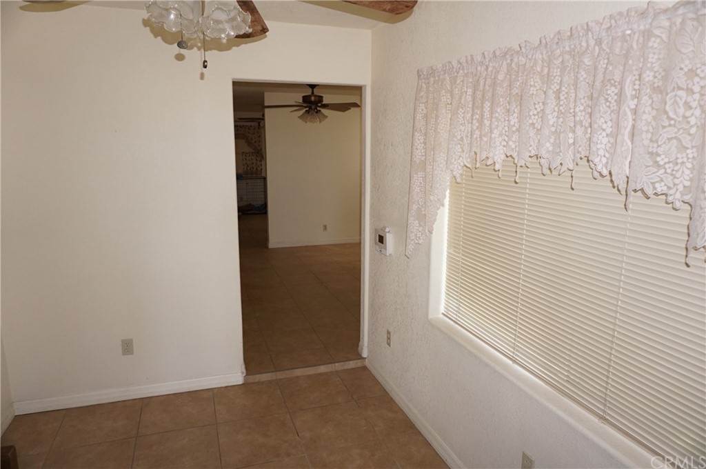 27841 Crestview Road Barstow, CA 92311 - Photo 7 of 28 a view of a closet area with ceiling fan