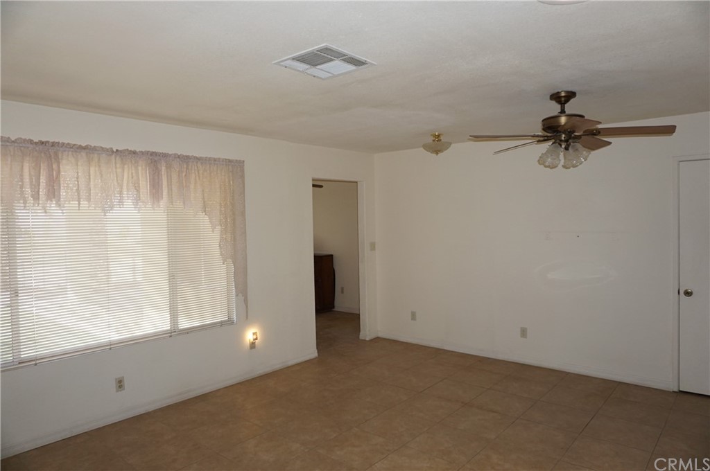 27841 Crestview Road Barstow, CA 92311 - Photo 10 of 28 a view of room with a ceiling fan and window