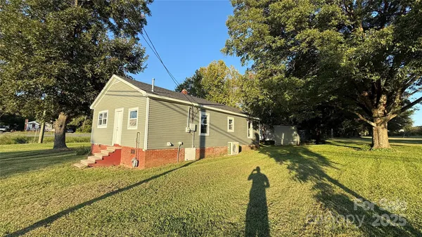 a view of swimming pool with a backyard
