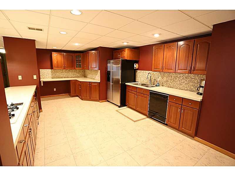 1713 Beaver Grade Road Coraopolis, PA 15108 - Photo 16 of 25 Kitchen. Lower level kitchen is fully equipped, including a wine fridge, and offers plenty of storage and prep space for entertaining a crowd. All appliances are being sold "as is".