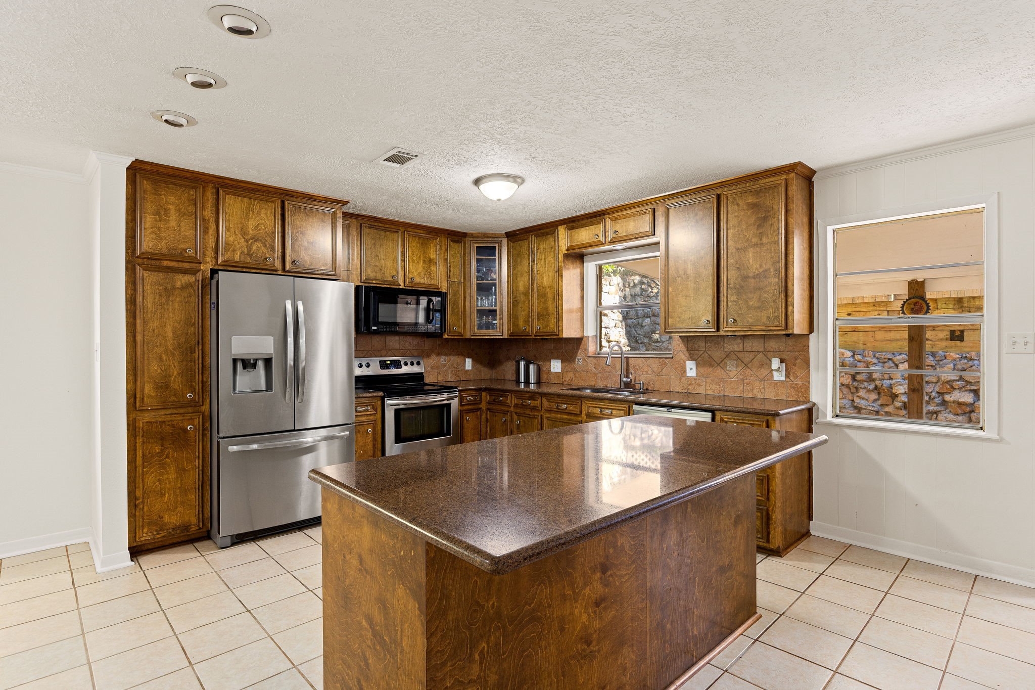113 Hillendale Street Livingston, TX 77351 - Photo 14 of 47 Well-appointed kitchen with abundant cabinetry and counter space.