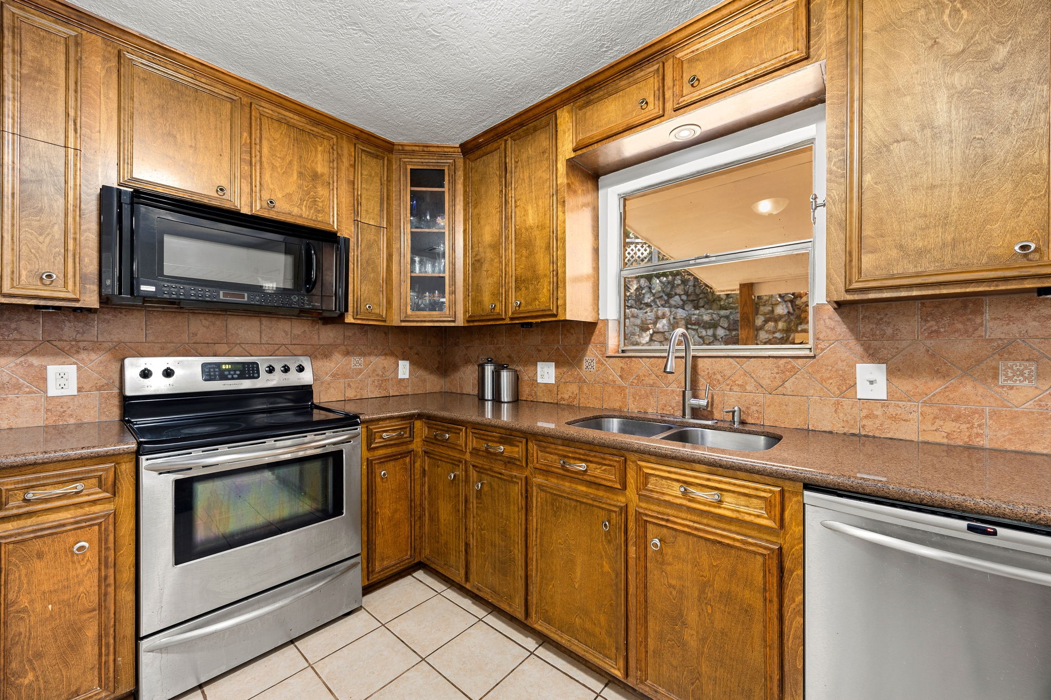 113 Hillendale Street Livingston, TX 77351 - Photo 16 of 47 Functional kitchen design with ample storage and workspace.
