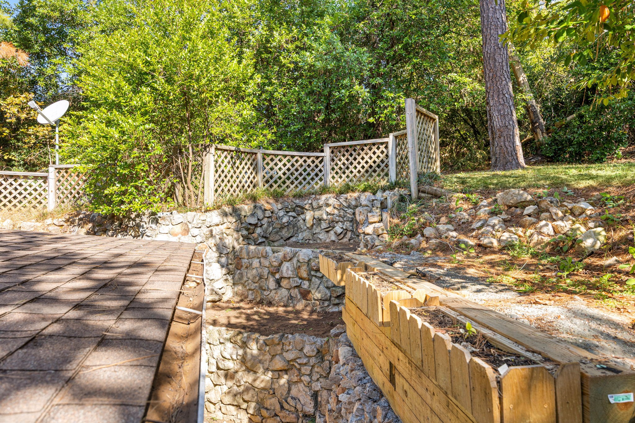 113 Hillendale Street Livingston, TX 77351 - Photo 34 of 47 Elevated walkway with stone retaining walls and wooded views.