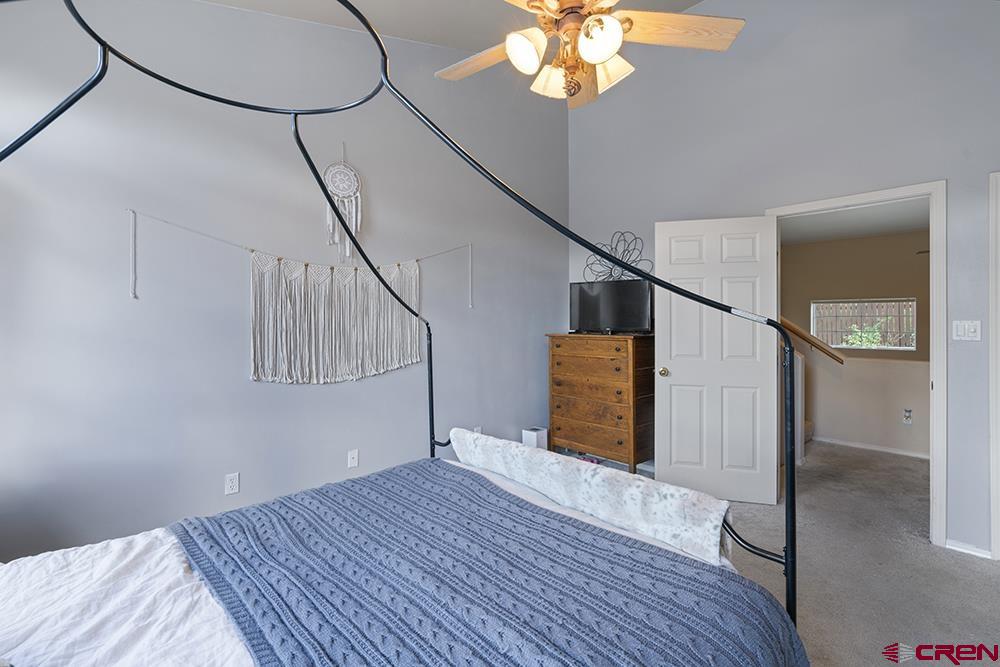 332 Jenkins Ranch Road Durango, CO 81301 - Photo 15 of 34 a view of a hallway with wooden floor and staircase