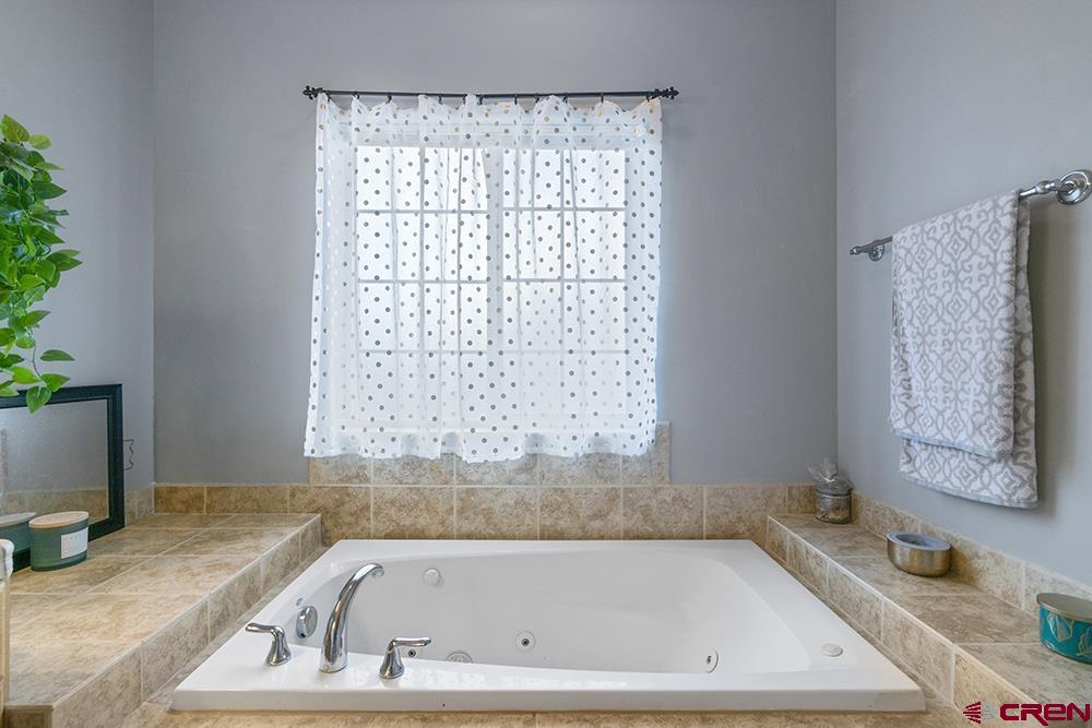 332 Jenkins Ranch Road Durango, CO 81301 - Photo 18 of 34 a bathroom with a bathtub and shower