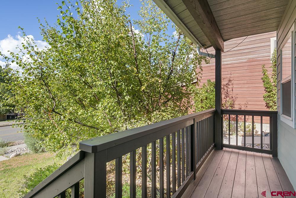 332 Jenkins Ranch Road Durango, CO 81301 - Photo 29 of 34 a balcony with wooden floor and fence