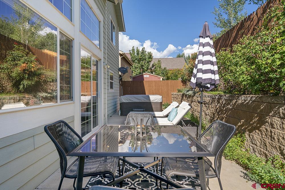 332 Jenkins Ranch Road Durango, CO 81301 - Photo 30 of 34 a view of a patio with table and chairs and potted plants