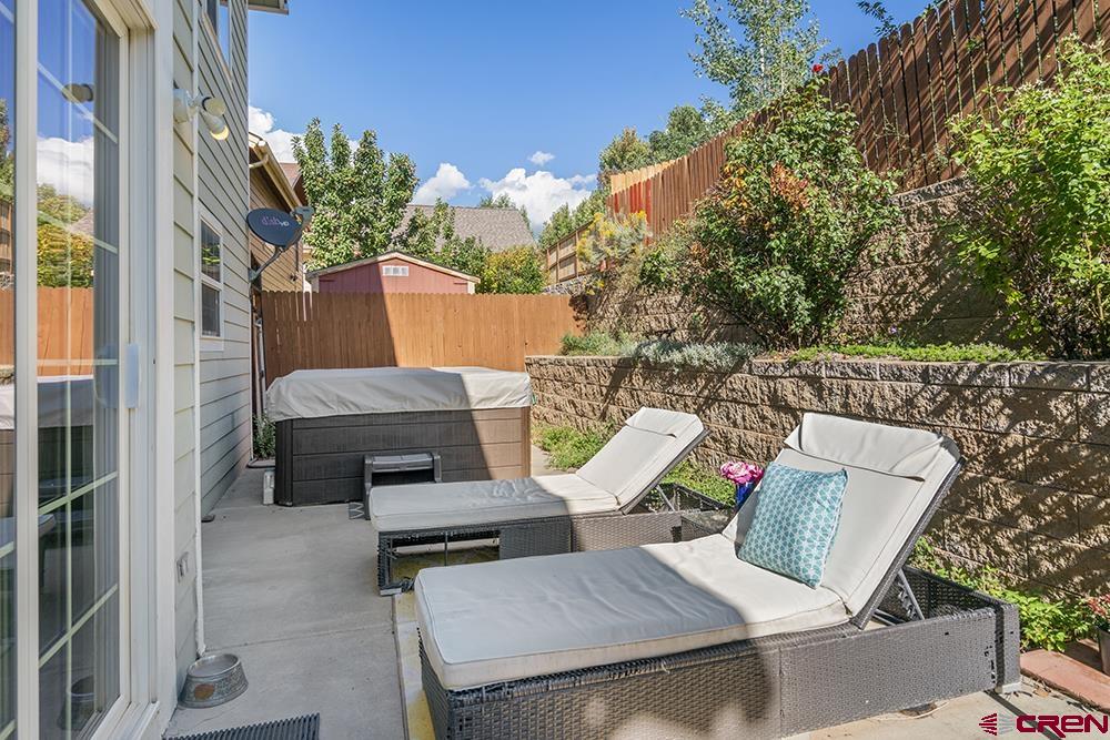 332 Jenkins Ranch Road Durango, CO 81301 - Photo 31 of 34 a view of a patio with table and chairs with potted plants