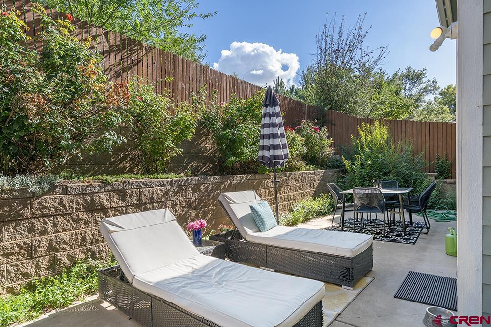 332 Jenkins Ranch Road Durango, CO 81301 - Photo 32 of 34 a view of a patio with couches table and chairs and potted plants