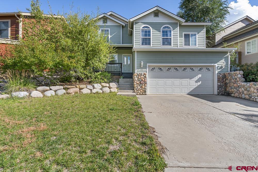 332 Jenkins Ranch Road Durango, CO 81301 - Photo 33 of 34 a front view of a house with a garden and yard