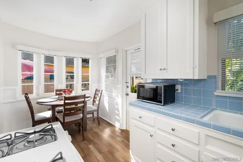 a kitchen with stainless steel appliances kitchen island granite countertop a sink and cabinets