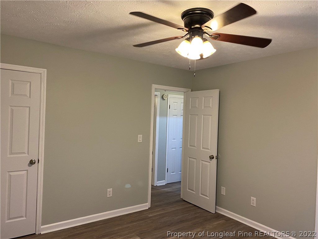 1734 Rim Road Fayetteville, NC 28314 - Photo 12 of 24 wooden floor in an empty room