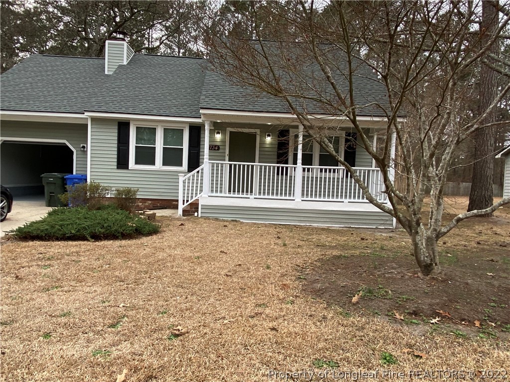 1734 Rim Road Fayetteville, NC 28314 - Photo 2 of 24 a house with trees in front of it