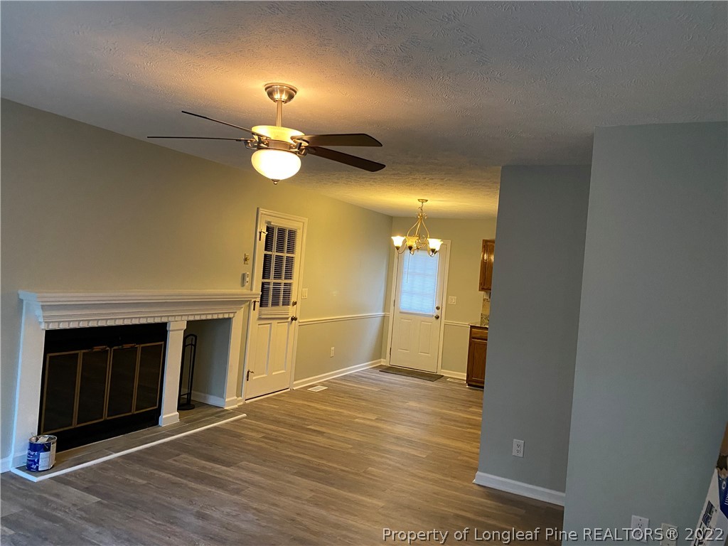 1734 Rim Road Fayetteville, NC 28314 - Photo 3 of 24 a view of a livingroom with wooden floor