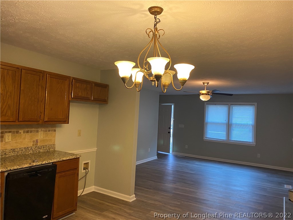 1734 Rim Road Fayetteville, NC 28314 - Photo 4 of 24 a view of a kitchen with a sink cabinets and wooden floor