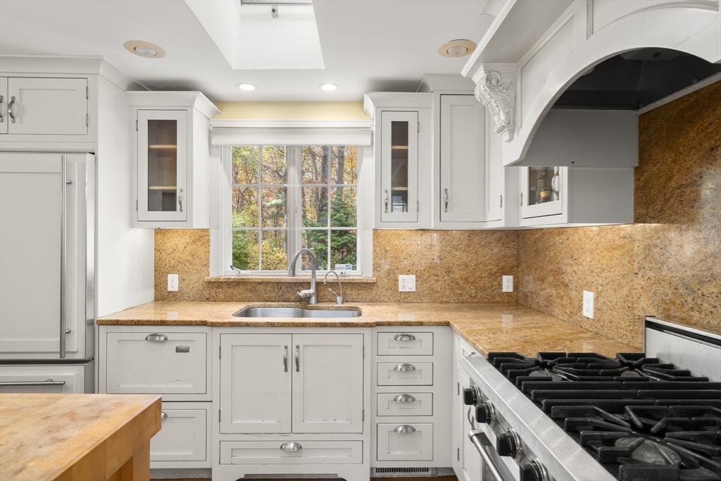 154 Fairview Avenue Rehoboth, MA 02769 - Photo 15 of 25 a kitchen with granite countertop a stove and a sink