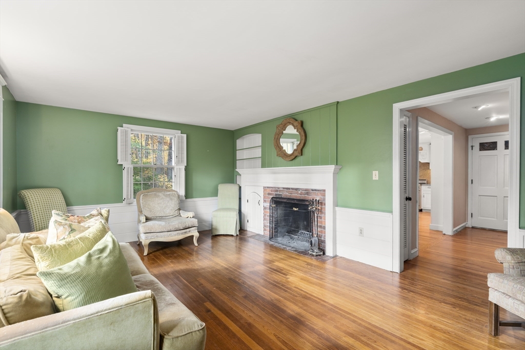 154 Fairview Avenue Rehoboth, MA 02769 - Photo 18 of 25 a living room with furniture and a fireplace