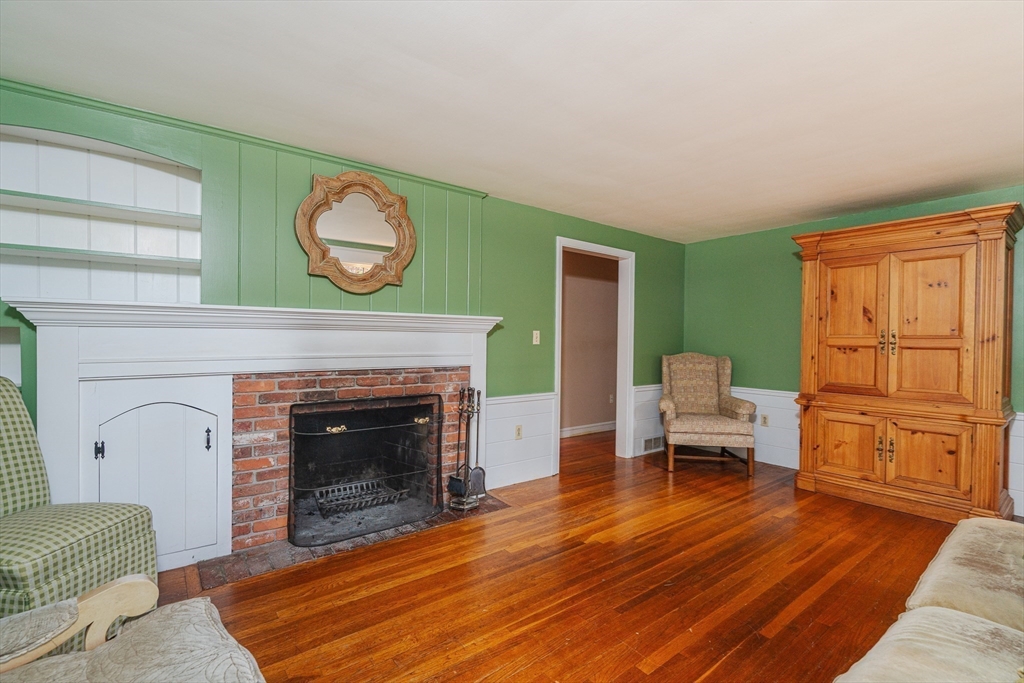 154 Fairview Avenue Rehoboth, MA 02769 - Photo 19 of 25 a living room with furniture and a fireplace