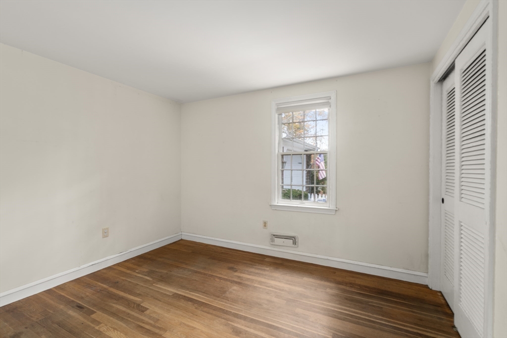 154 Fairview Avenue Rehoboth, MA 02769 - Photo 24 of 25 an empty room with wooden floor and windows