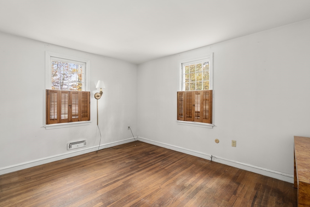 154 Fairview Avenue Rehoboth, MA 02769 - Photo 25 of 25 a view of an empty room with wooden floor and a window