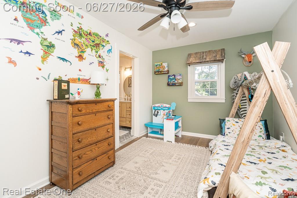 1222 Kings Cove Court, Unit 244 Rochester, MI 48306 - Photo 23 of 44 Bedroom #2 with ceiling fan, wood floor and private bath.