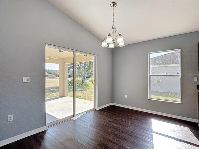 a view of kitchen with cabinets and wooden floor