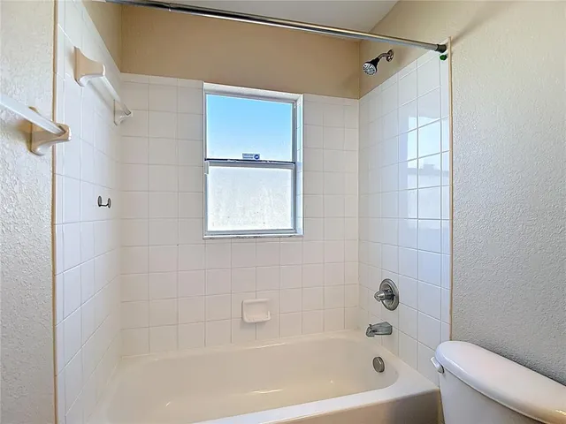 a view of empty room with windows