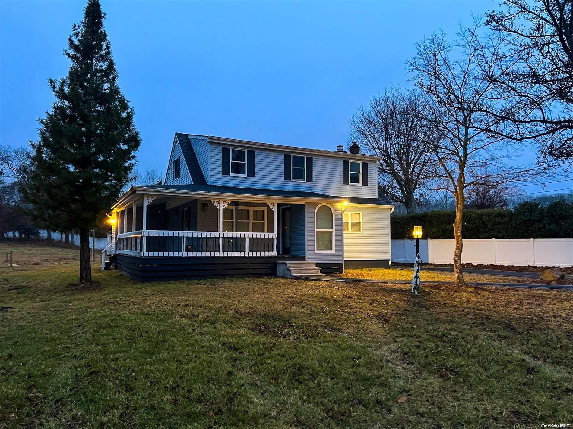 26 Woodlot Road Ridge, NY 11961 - Photo 1 of 1 a front view of a house with a yard