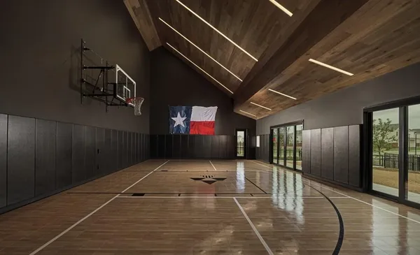 a view of a room with wooden floor