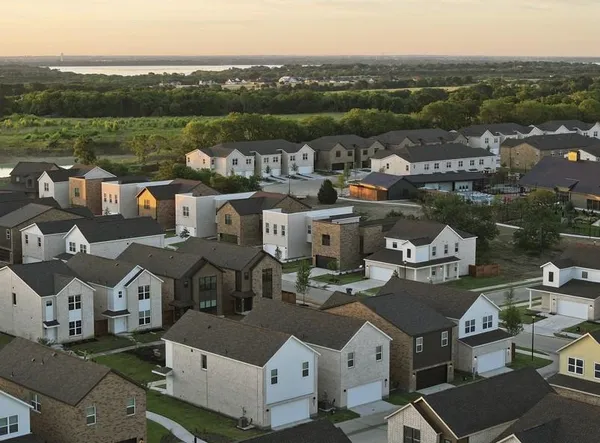 an aerial view of a house with a lake view