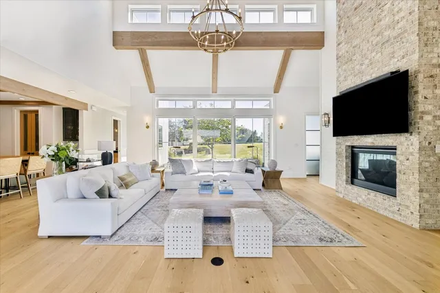 a living room with fireplace furniture and a flat screen tv