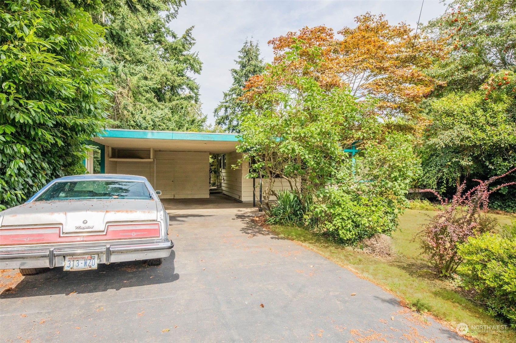 225 76th Street Southwest Everett, WA 98203 - Photo 23 of 26 a car parked in front of white house