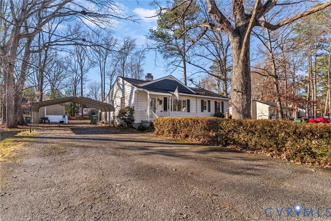 1408 Boroughbridge Road Richmond, VA 23225 - Photo 3 of 31 a front view of a house with a garden