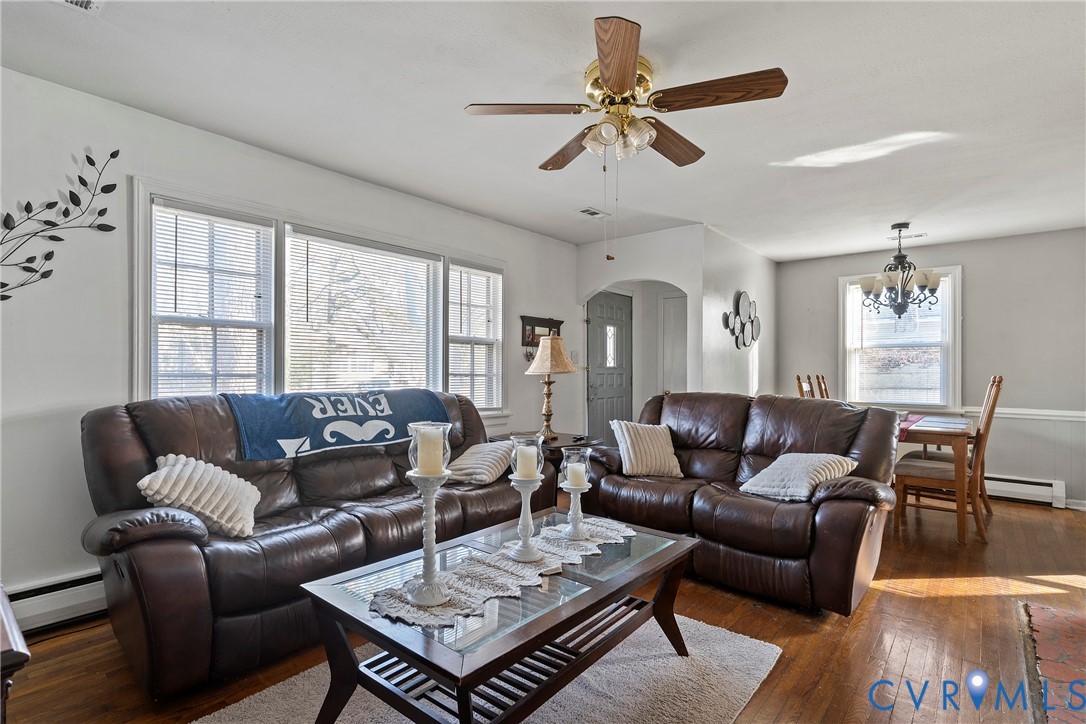 1408 Boroughbridge Road Richmond, VA 23225 - Photo 6 of 31 a living room with furniture a ceiling fan a flat screen tv and a window