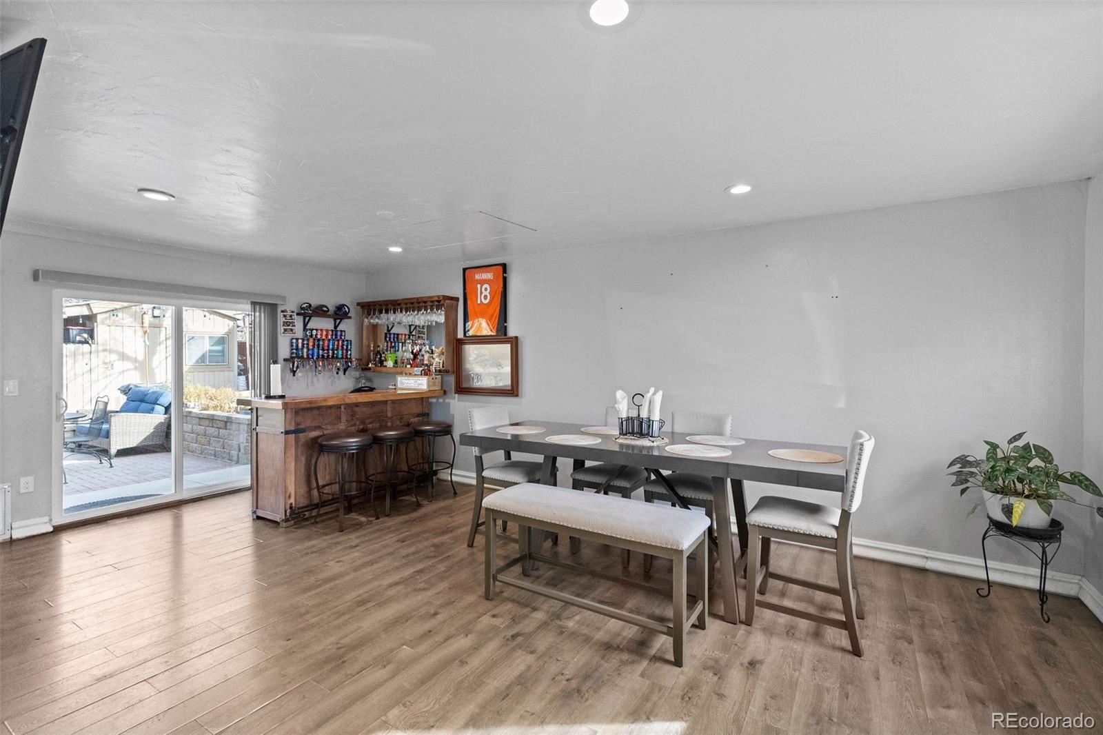 642 South Racine Street Aurora, CO 80012 - Photo 12 of 36 a living room with furniture and a wooden floor