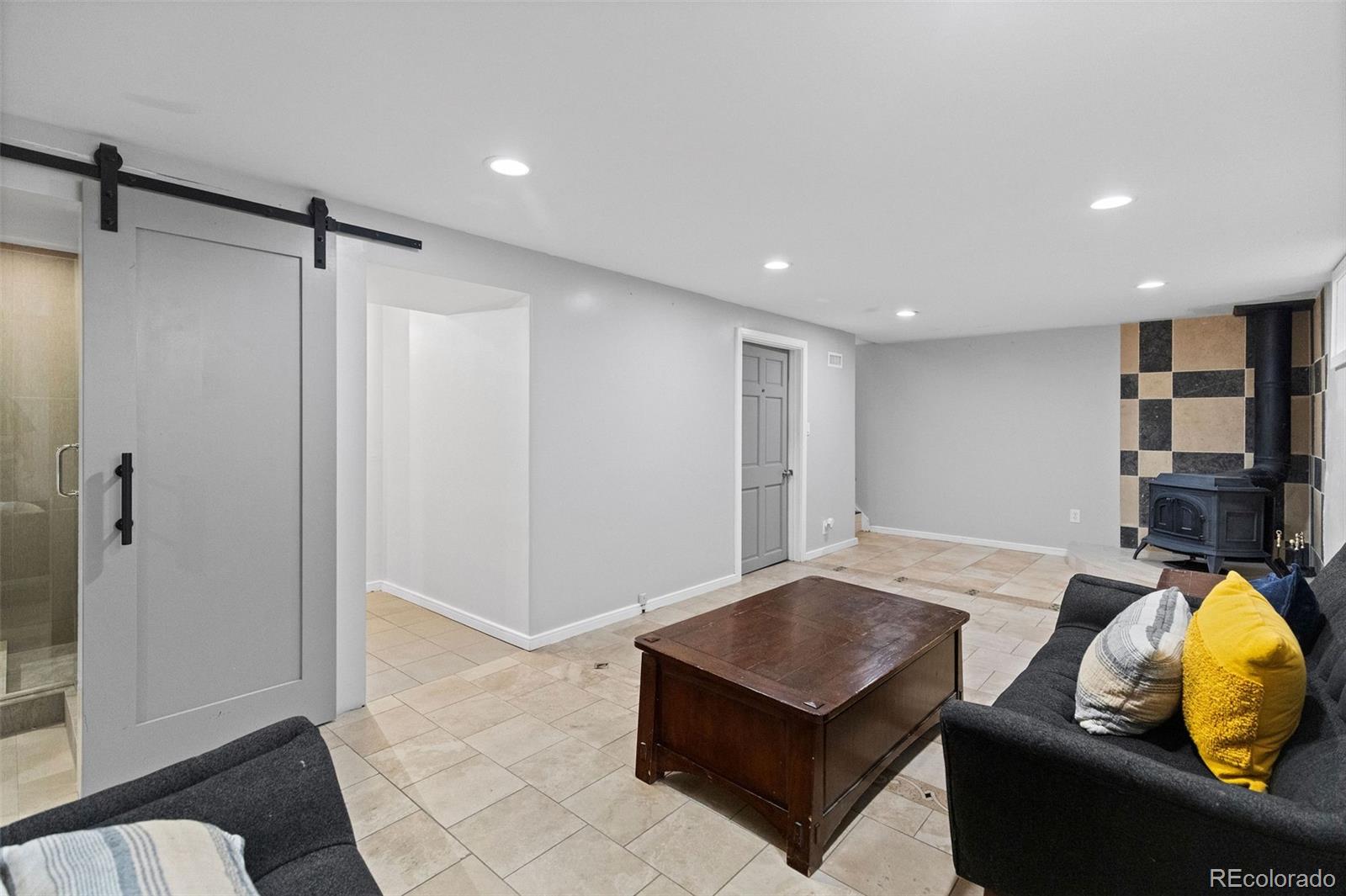642 South Racine Street Aurora, CO 80012 - Photo 24 of 36 a living room with furniture and wooden floor