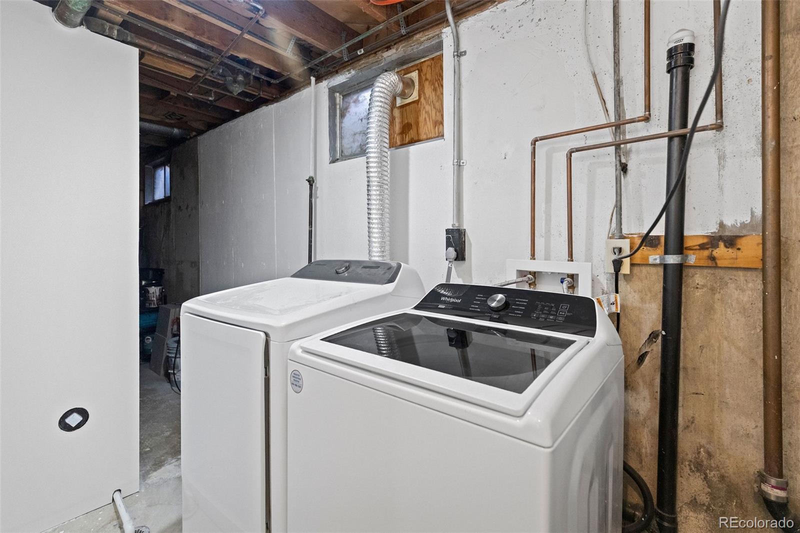 642 South Racine Street Aurora, CO 80012 - Photo 25 of 36 a view of storage and utility room with washer and dryer