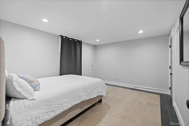 a bedroom with a bed and a walk in closet