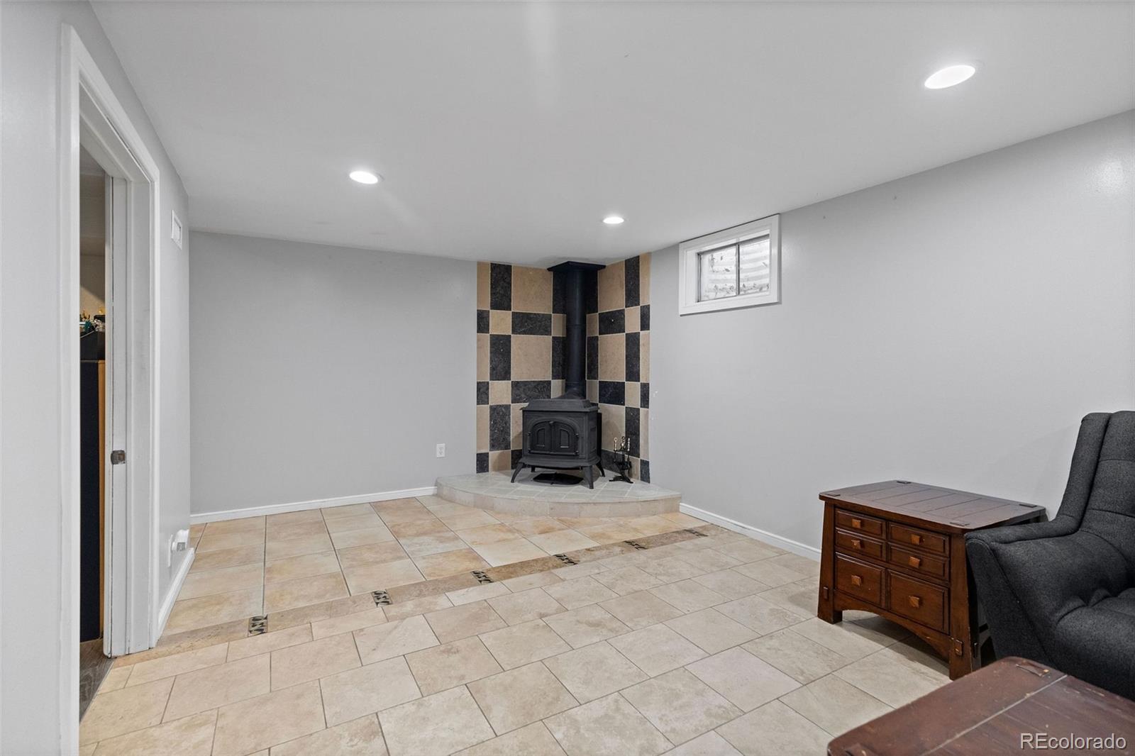 642 South Racine Street Aurora, CO 80012 - Photo 30 of 36 a view of a livingroom with furniture and storage
