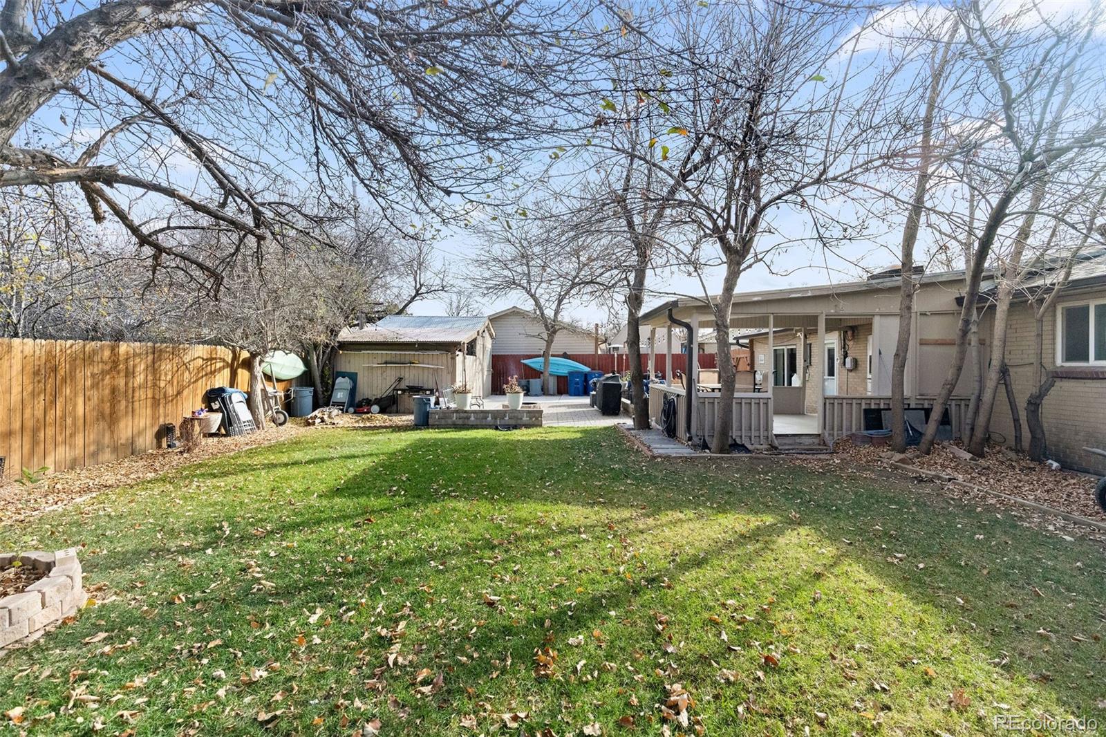 642 South Racine Street Aurora, CO 80012 - Photo 33 of 36 a view of a house with backyard and sitting area