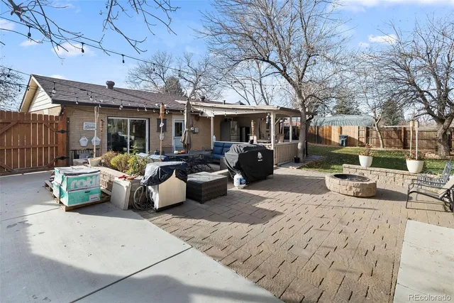 a view of a patio with couches and potted plants