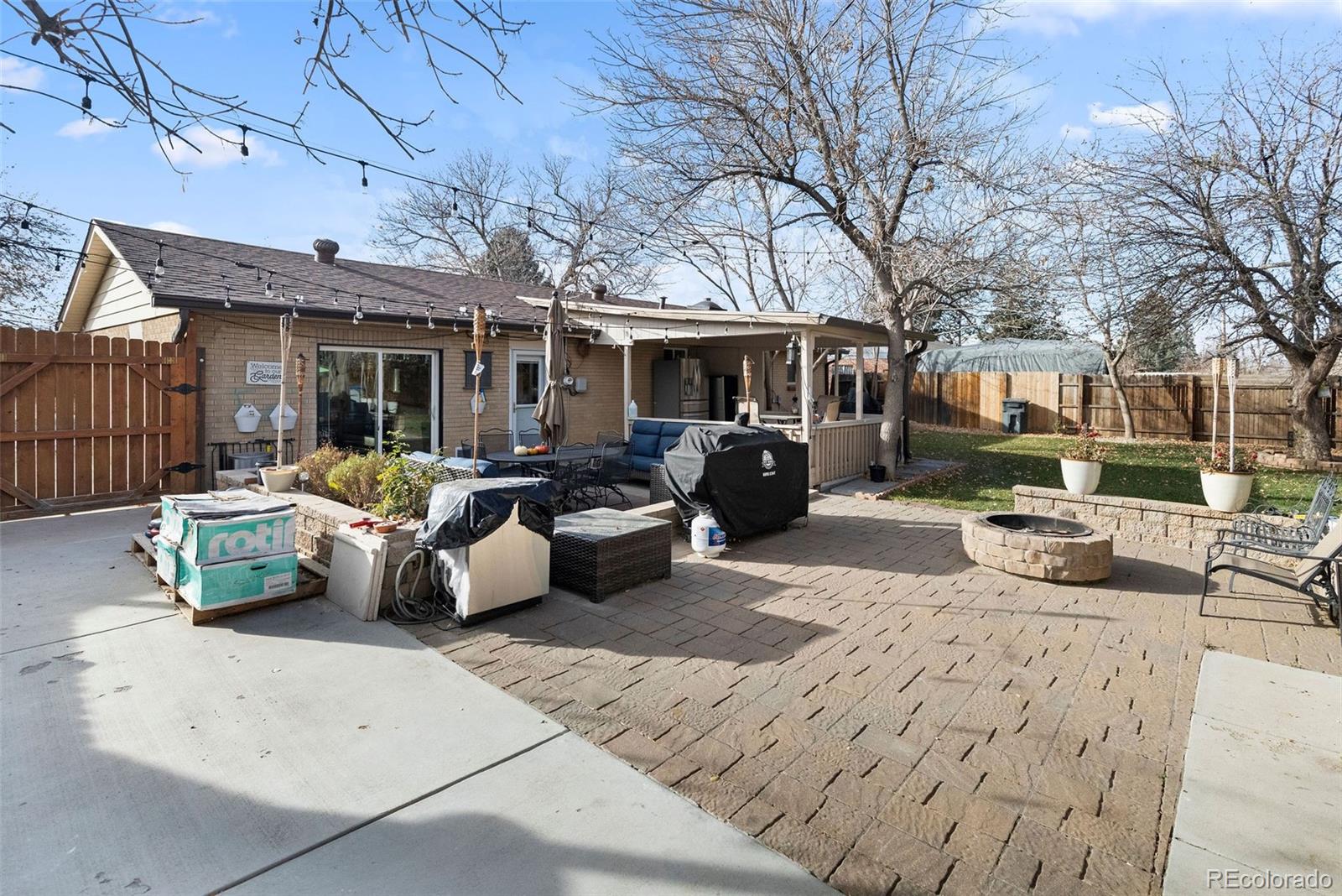 642 South Racine Street Aurora, CO 80012 - Photo 35 of 36 a view of a patio with couches and potted plants