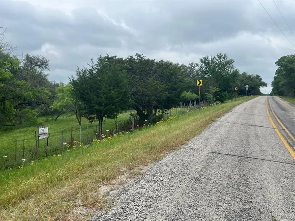 a view of street with small yard